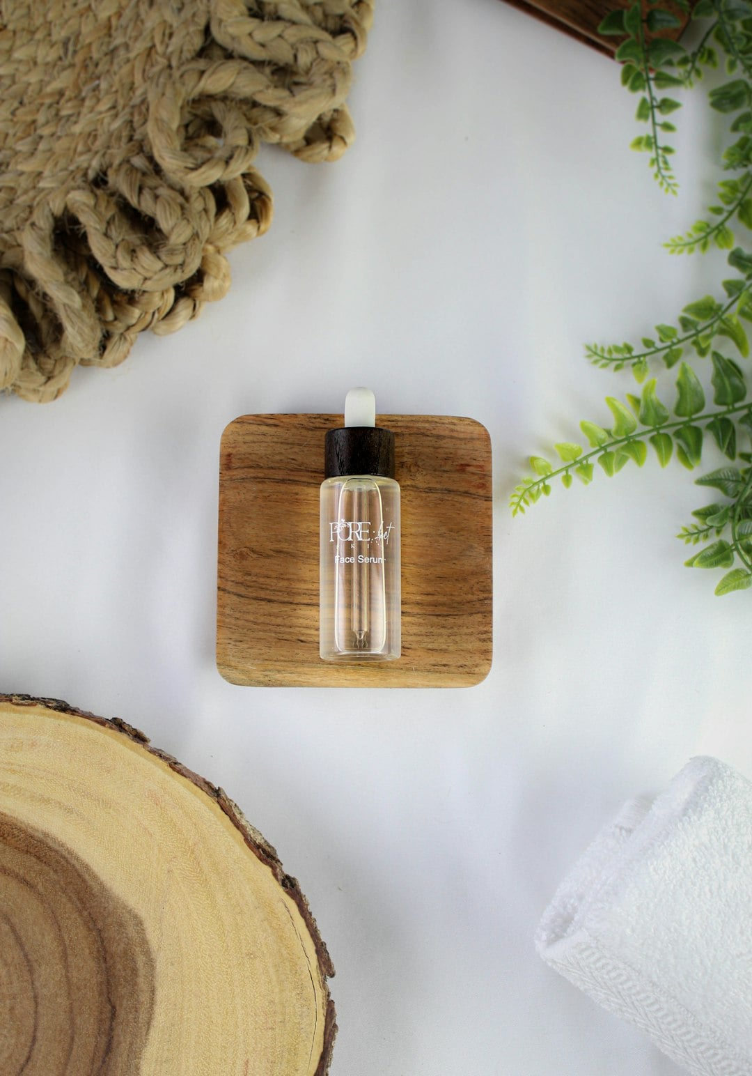 Natural serum bottle with plants, photo by Tiffany Oakley on Unsplash